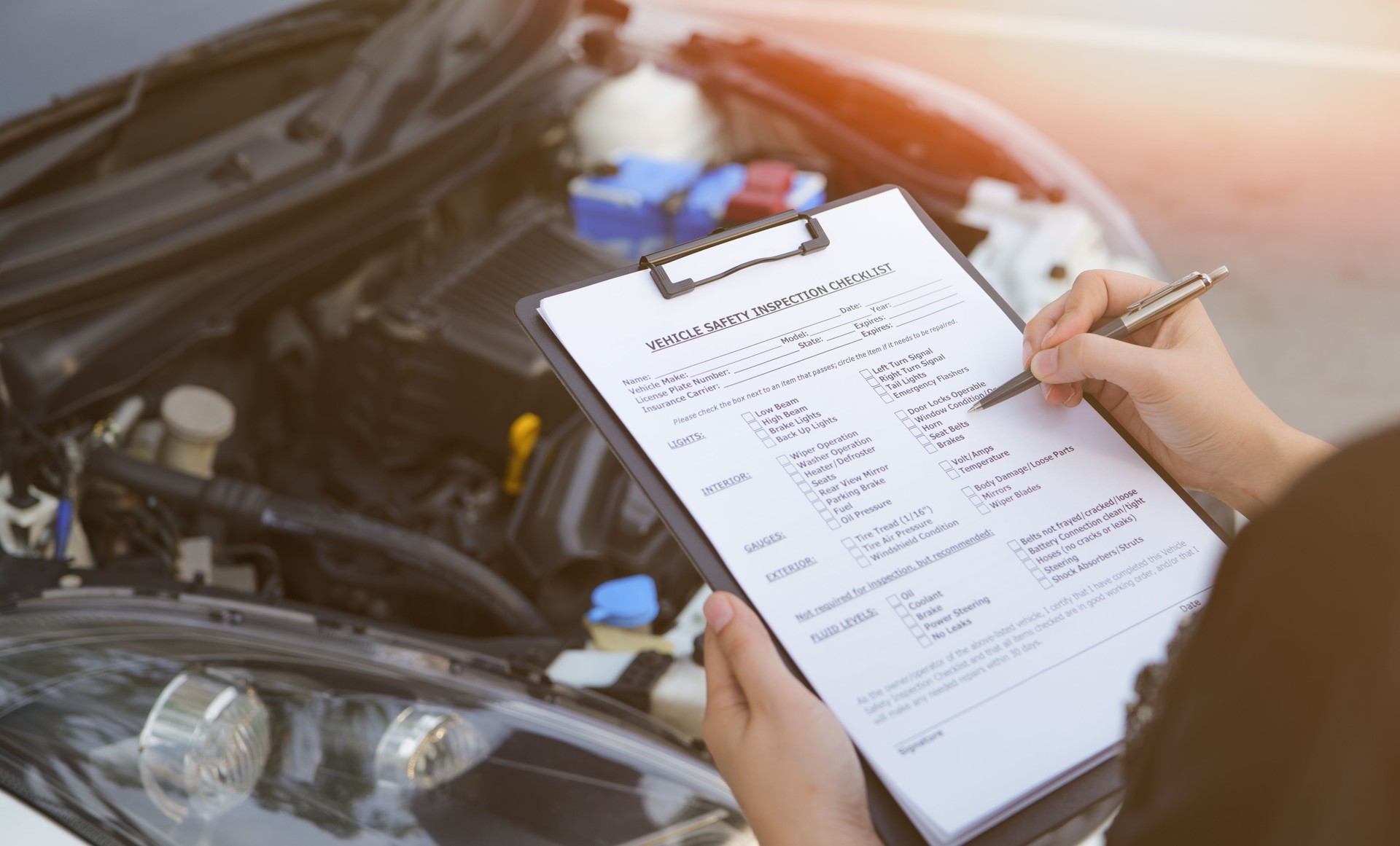Checklist vehicle inspection. car mechanic repairman checking a car engine with inspecting writing on clipboard the checklist for repair car, Car Repairs, vehicle maintenance, Automotive mechanic,
